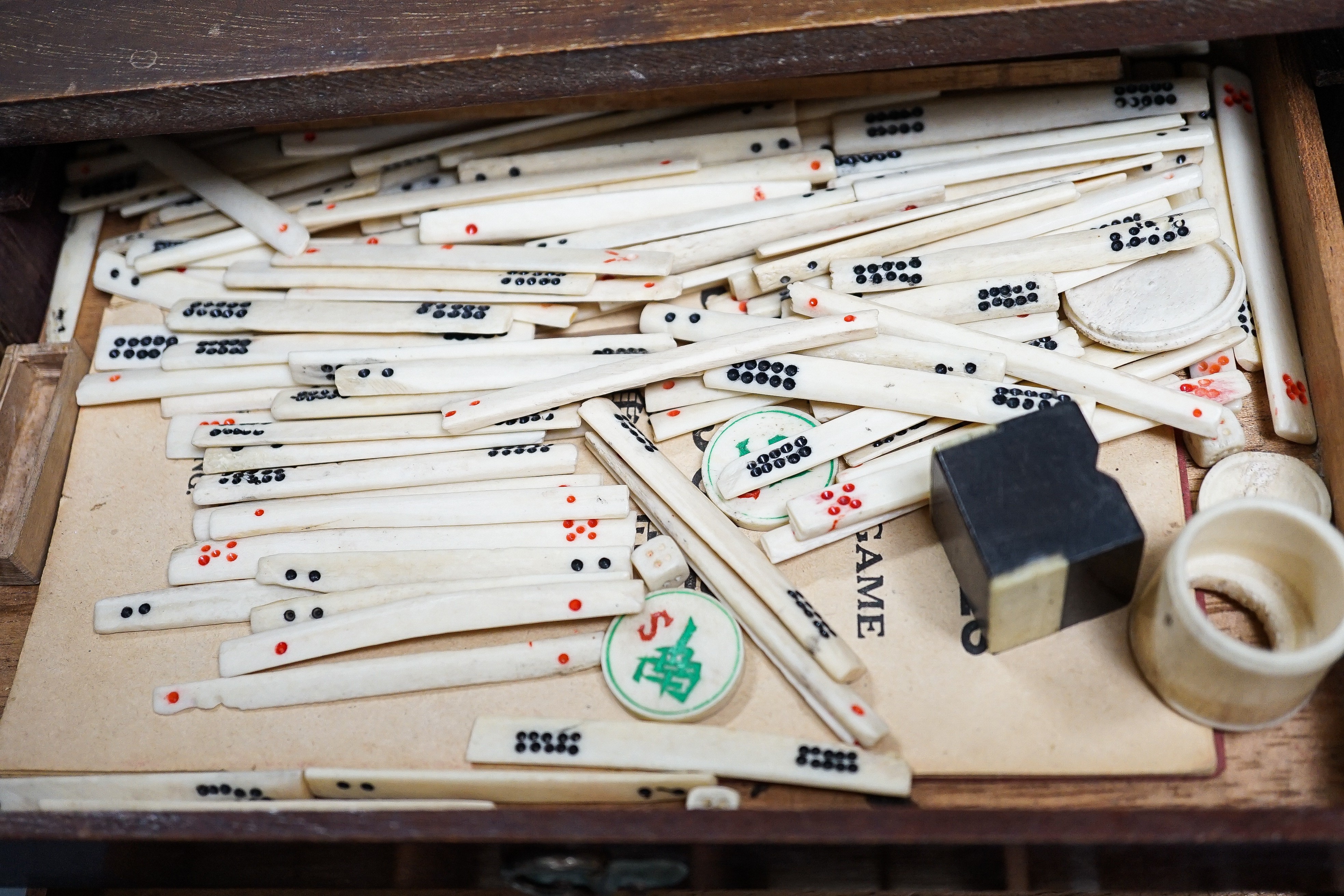 A Mah Jong set in wooden box, 17 cms high.